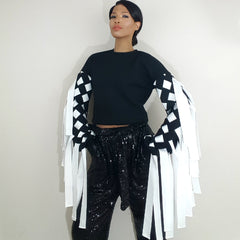 Nicole Spruill, black fringe 3d Laser cut material fringe top color block black and white, celebrity stylist high fashion haute couture, sequined pants, Nik Spruill brand Haute Couture