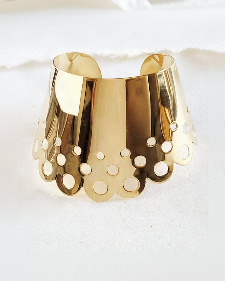 A close up of a Nik Spruill DAHOMEY CUFF on a white surface.