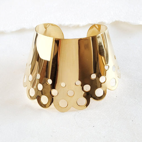 A close up of a Nik Spruill DAHOMEY CUFF on a white surface.
