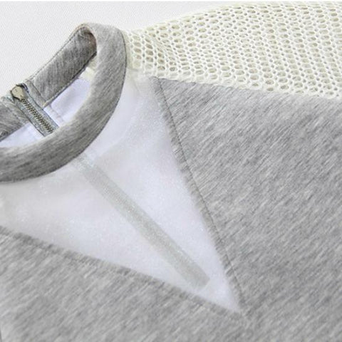 A close up of a Waves Top by Nik Spruill on a hanger.
